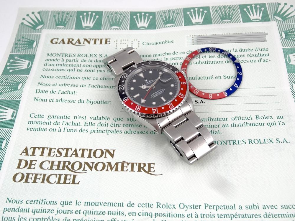 Rolex GMT II Rouge & Noir Full Set avec 2 lunettes