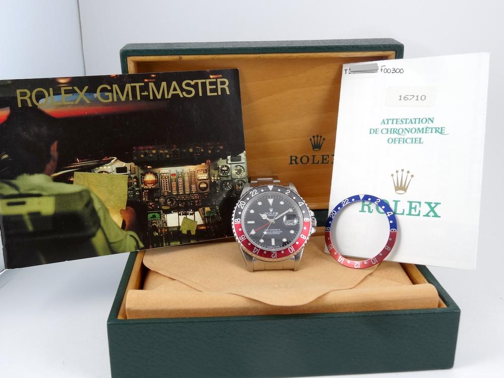 Rolex GMT II Rouge & Noir Full Set avec 2 lunettes
